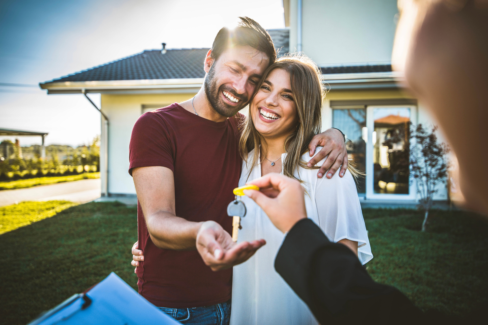 Happy new homeowners receiving keys to their Athens GA home · buyer representation by Pamela Michna Properties